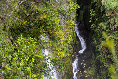 Waterfall view while hiking the Sendero Cascadas Escondidas in the Parque Nacional Pumalín Douglas Tompkins in Patagonia, Chile 