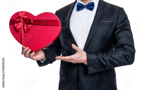 Obraz na płótnie cropped view of man in tuxedo holding gift for valentines day