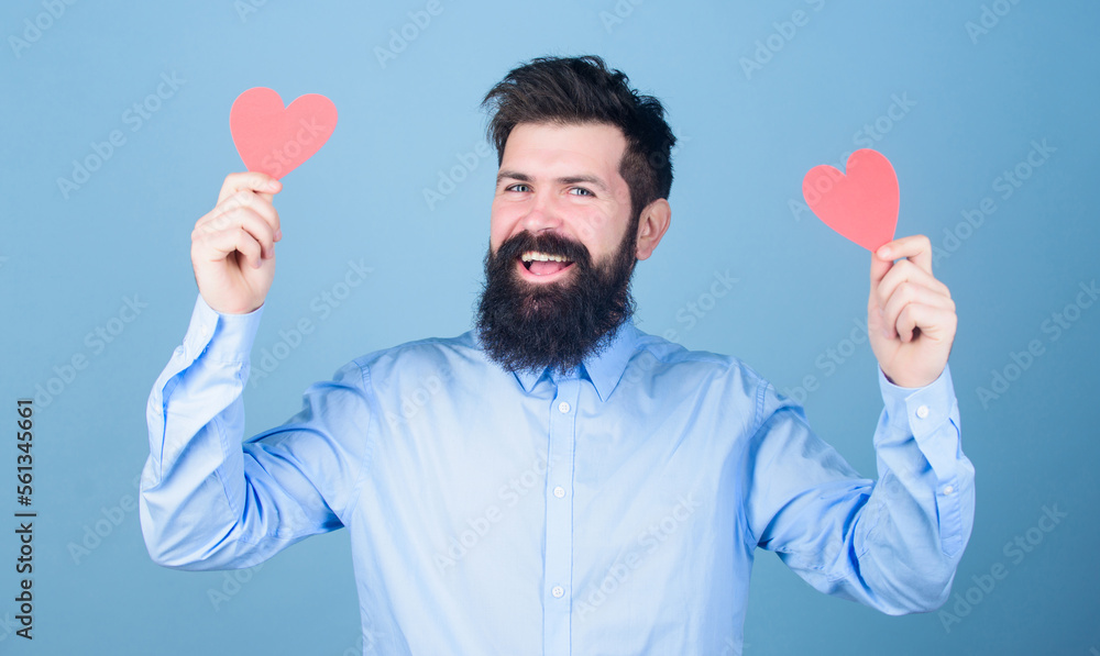 Dating and relations concept. Happy in love. Falling in love. Man bearded hipster with heart valentine card. Celebrate love. Guy attractive with beard and mustache in romantic mood. Feeling love Dating and relations concept. Happy in love. Falling in love. Man bearded hipster with heart valentine card. Celebrate love. Guy attractive with beard and mustache in romantic mood. Feeling love