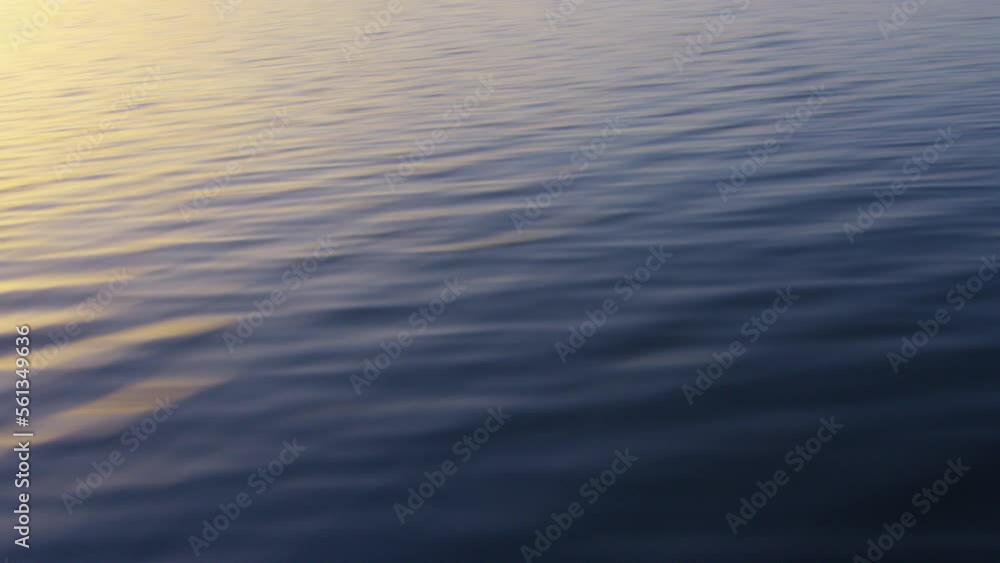 The water scrolls from a boat on Lake Geneva at sunrise, in Switzerland The water scrolls from a boat on Lake Geneva at sunrise, in Switzerland