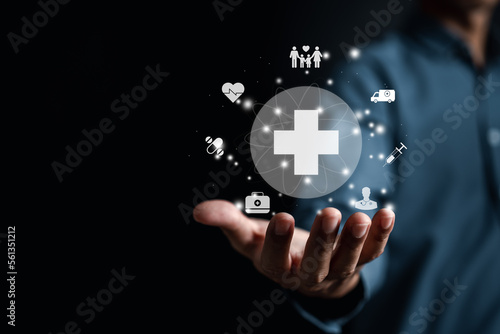 Health insurance. Man hand holding plus and healthcare medical icon, health and access to welfare health concept...