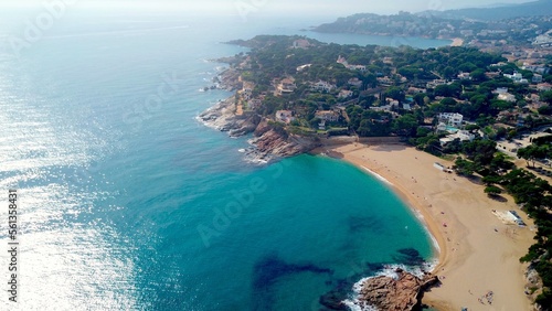 aerial view of bay with the beach Cala sa Conca in S'Agaró an upmarket resort on the Costa Brava between Sant Feliu de Guíxols and Platja d'Aro with exclusive houses and hotels, Catalonia, Spain