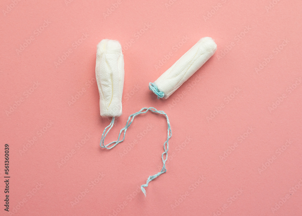Tampons lying on a pink background, female menstruation Tampons lying on a pink background, female menstruation