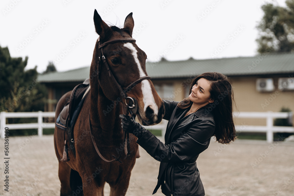 Obraz premium Horse riding. A young woman with a horse.