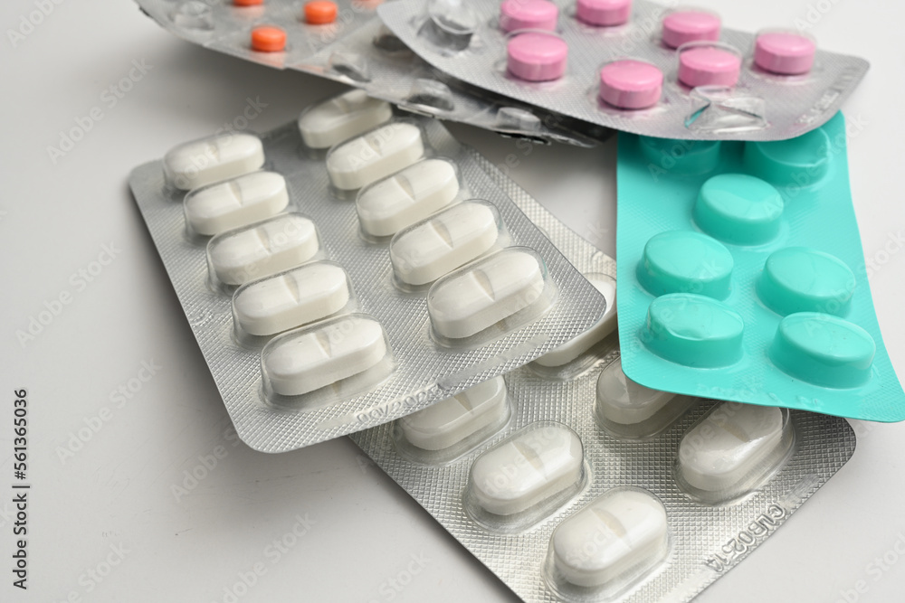 Various drugs, opened and unopened painkiller pills Various drugs, opened and unopened painkiller pills