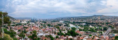 Panoramic view over old town and modern architecture of Tbilisi, Georgia. Cityscape of Mtkvari or Kura river, Cathedral, bridge of peace, Rike park. Tiflis is popular tourist destination