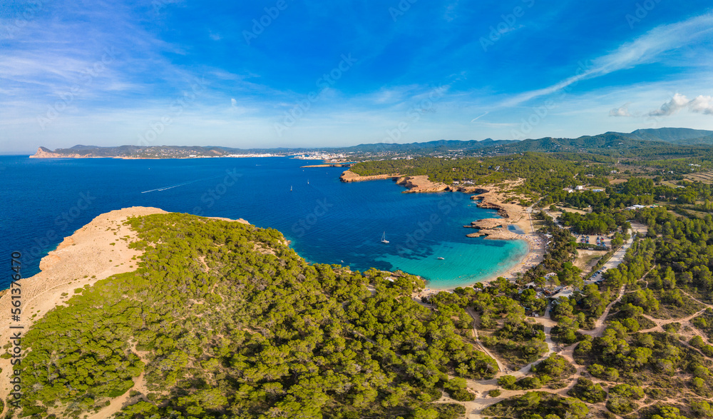 Ibiza Cala Bassa beach with turquoise water, aerial views