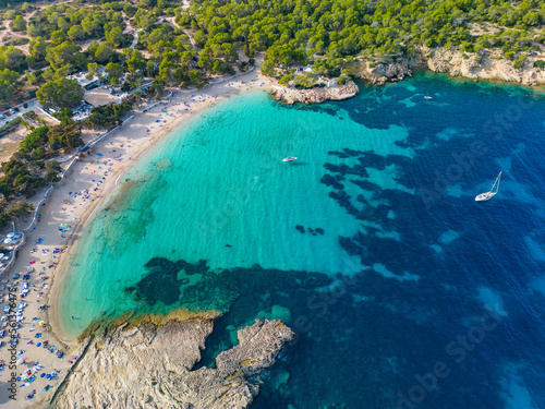 Ibiza Cala Bassa beach with turquoise water  aerial views