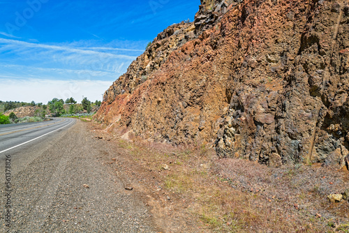 Rocky cliffs line the edge of Highway 26 near Dayville, Oregon, USA photo