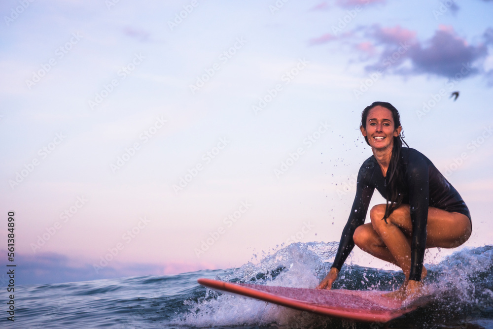 Water women friends surfing together at sunset Water women friends surfing together at sunset