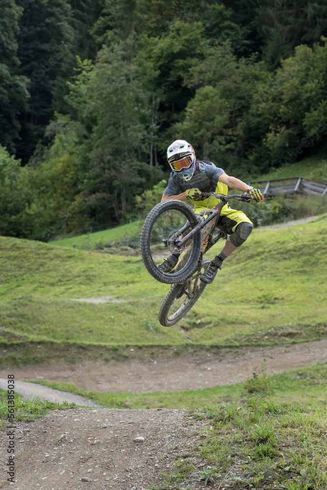 Free rider jumping in bike park, Saalfelden, Tyrol, Austria Free rider jumping in bike park, Saalfelden, Tyrol, Austria