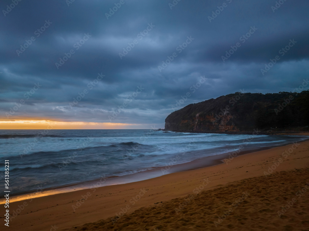 Sunrise over the ocean with rain clouds Sunrise over the ocean with rain clouds