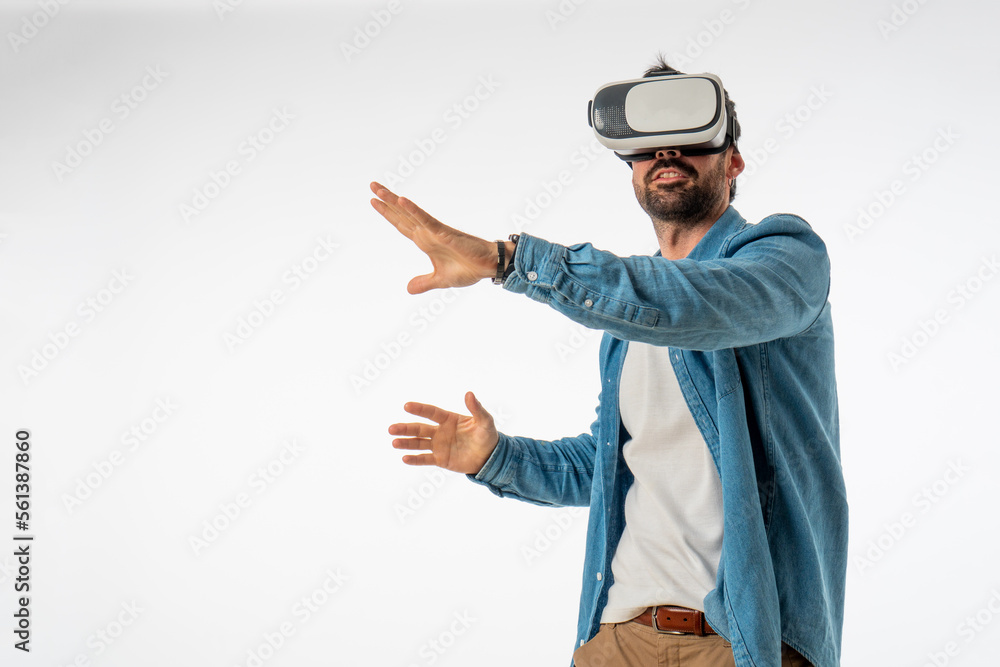 young handsome man with virtual reality goggles on white background. copy space young handsome man with virtual reality goggles on white background. copy space