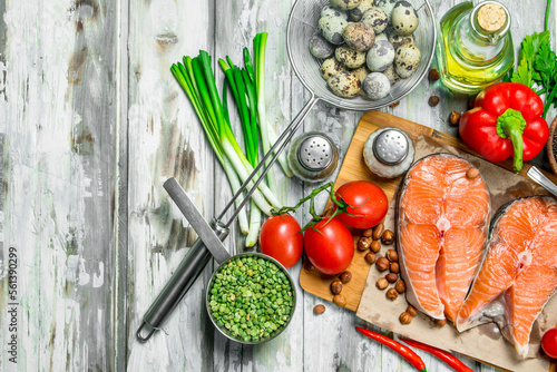 Healthy food. Salmon steaks with organic food. photo