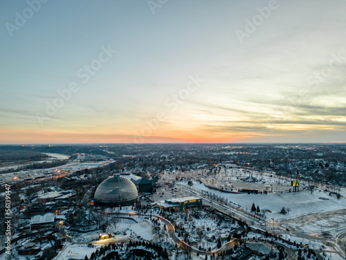 Vertical Aerial image of the Henry Doorly Zoo and Aquarium Omaha Nebraska Zoo Futuristic dome in the winter covered in snow at sunset photo