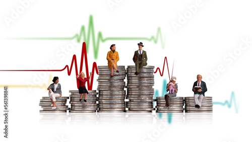 Business concept with coins and miniature people. Various miniature people sitting on piles of coins of different heights.

