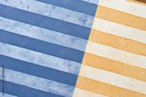 scrapbook paper with wide stripes in blue and orange yellow