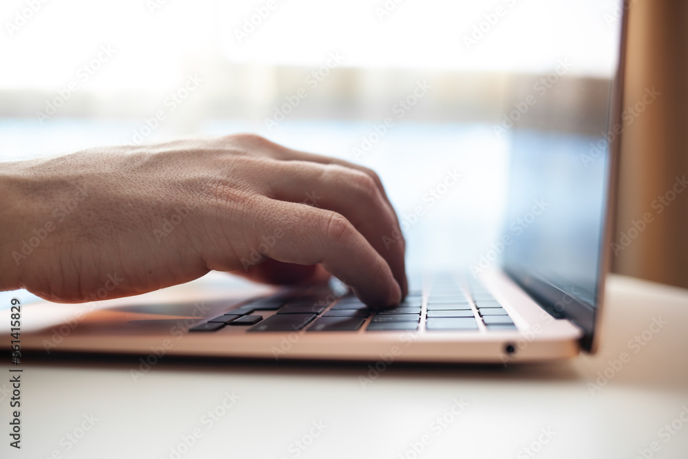 Purchases via the Internet and payment for services buy credit card. Hands type text and enter data on the laptop keyboard. An office worker checks his email while sitting at his desk Purchases via the Internet and payment for services buy credit card. Hands type text and enter data on the laptop keyboard. An office worker checks his email while sitting at his desk