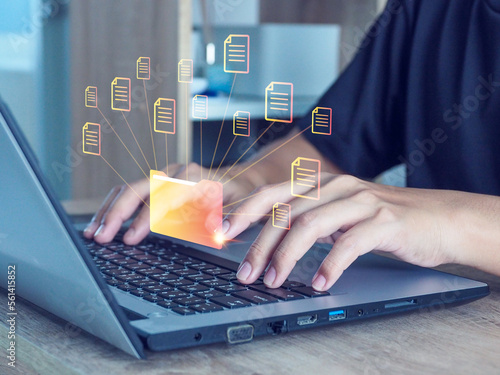 Obraz na plátně Businessman handling online document database files (DMS), searching and managing database files with automated processes