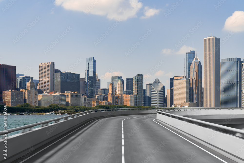 Fototapeta premium Empty urban asphalt road exterior with city buildings background. New modern highway concrete construction. Concept of way to success. Transportation logistic industry fast delivery. Chicago. USA.