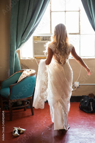 Bride walking back of wedding dress
