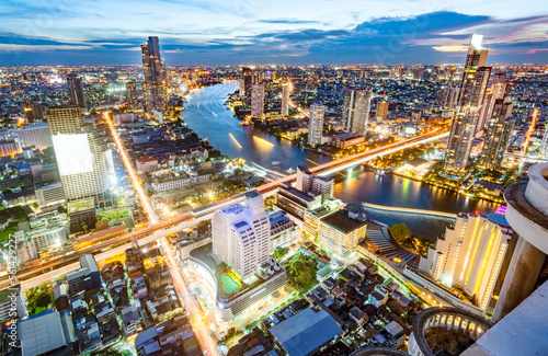 Aerial rooftop view of Bangkok at night, after dusk.
