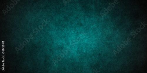 Dark green background with grunge backdrop texture, watercolor painted mottled green background, colorful bright ink and watercolor textures on black paper background.