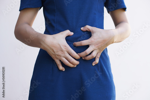 Woman suffer from stomachacheChronic gastritis Abdomen bloating concept photo