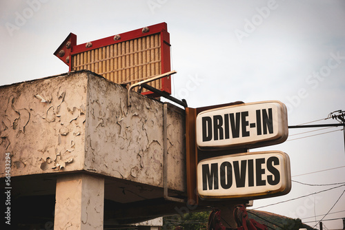 Aged and worn drive-in movies sign #561433294