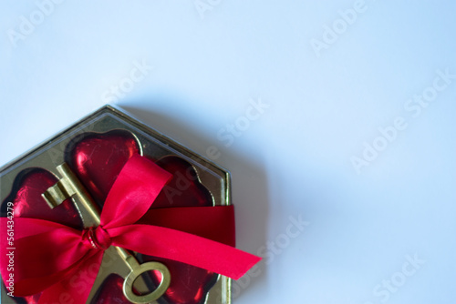 Valentine's photo. of a gift with a red ribbon on a white background leaving free space for text
