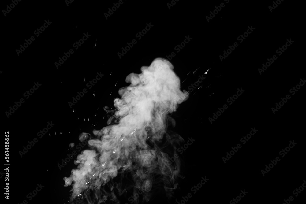 Obraz premium Close-up of white water vapor with water splashes flying in different directions from the humidifier Isolated on a black