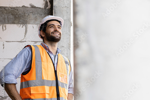 Wallpaper Mural engineer handsome man or architect looking forward with white safety helmet in construction site. Standing at modern building construction. Worker asian man working project building Torontodigital.ca