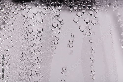 Drops and trickles of water on the glass.