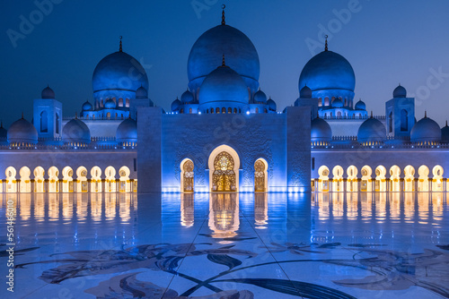 Symmetrical close up view during the blue hour of the majestic Sheik Zayed mosque in Abu Dhabi