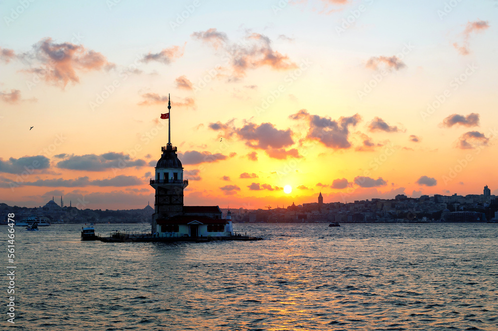 Stunning sunset panorama of Istanbul skyline and Maidens Tower on the Asian side of the Bosporus.
