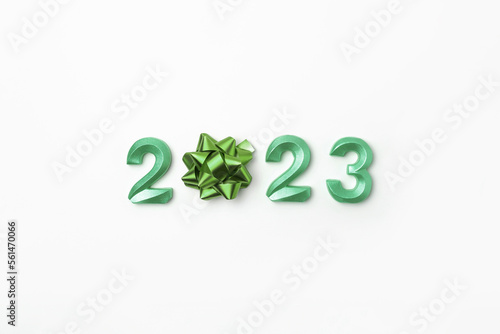 2023 Green Numbers on White Table. Modern New Year Background. Creative Greeting Card. Flat Lay, Top View, Copy Space. Banner Design. Minimal Festive Mock Up with Numbers. Time to Celebrate Holiday