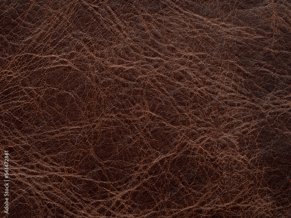 Genuine luxury dark brown vintage leather texture sample. Textured backdrop or background effective for design, upholstered furniture, clothing industry with place for text. Faux eco leather.