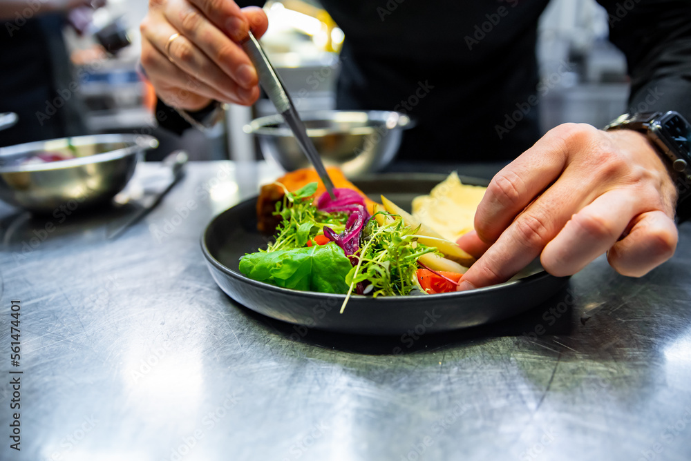 chef hand preparing Meat Pie with mashed potato and salad on restaurant kitchen chef hand preparing Meat Pie with mashed potato and salad on restaurant kitchen