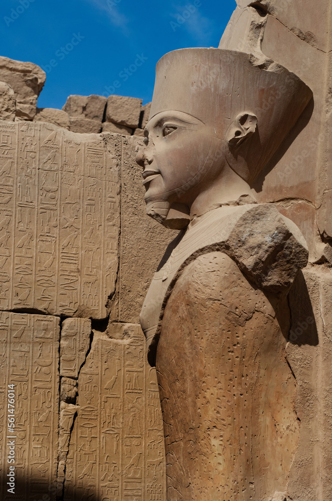 Historical statue of Pharaoh Queen at the ancient Egyptian ruins beside ...