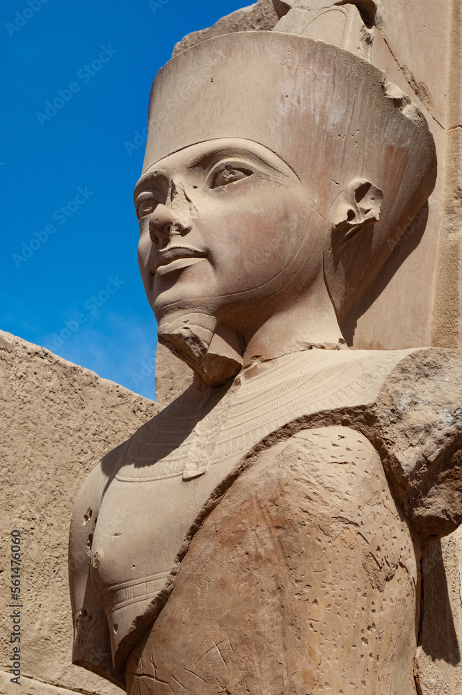 Stone statue of portrait Pharaoh queen at the ancient Egyptian temple ...