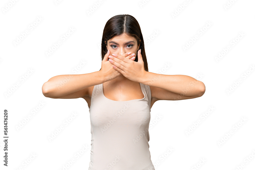 Young Russian woman over isolated chroma key background covering mouth with hands Young Russian woman over isolated chroma key background covering mouth with hands