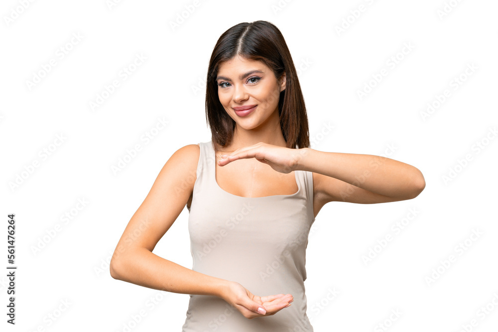 Young Russian woman over isolated chroma key background holding copyspace imaginary on the palm to insert an ad Young Russian woman over isolated chroma key background holding copyspace imaginary on the palm to insert an ad