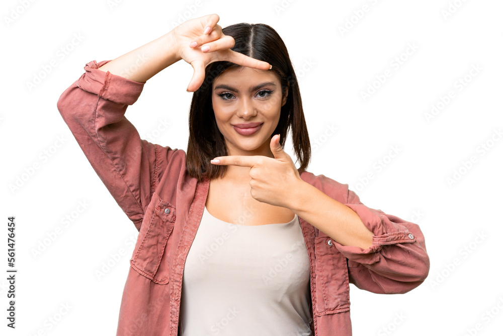 Young Russian woman over isolated chroma key background focusing face. Framing symbol Young Russian woman over isolated chroma key background focusing face. Framing symbol