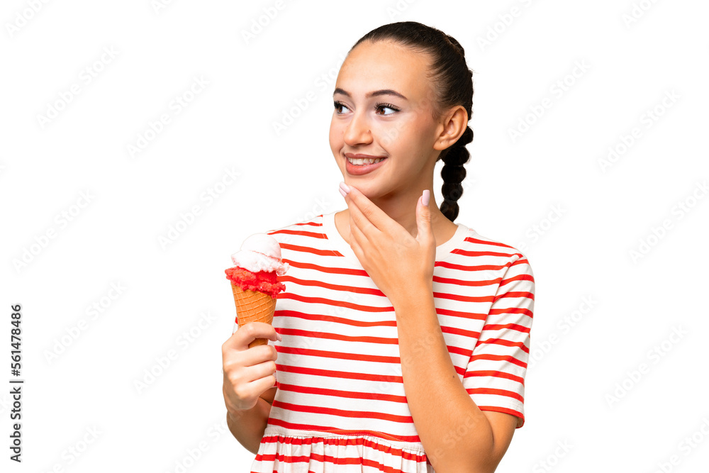 Young Arab woman with a cornet ice cream over isolated background looking up while smiling Young Arab woman with a cornet ice cream over isolated background looking up while smiling