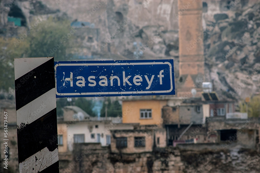 Obraz premium Sign post for the Turkish town of Hasankeyf on the banks of the Tigris River in south east Turkey under threat from construction of dam projects.