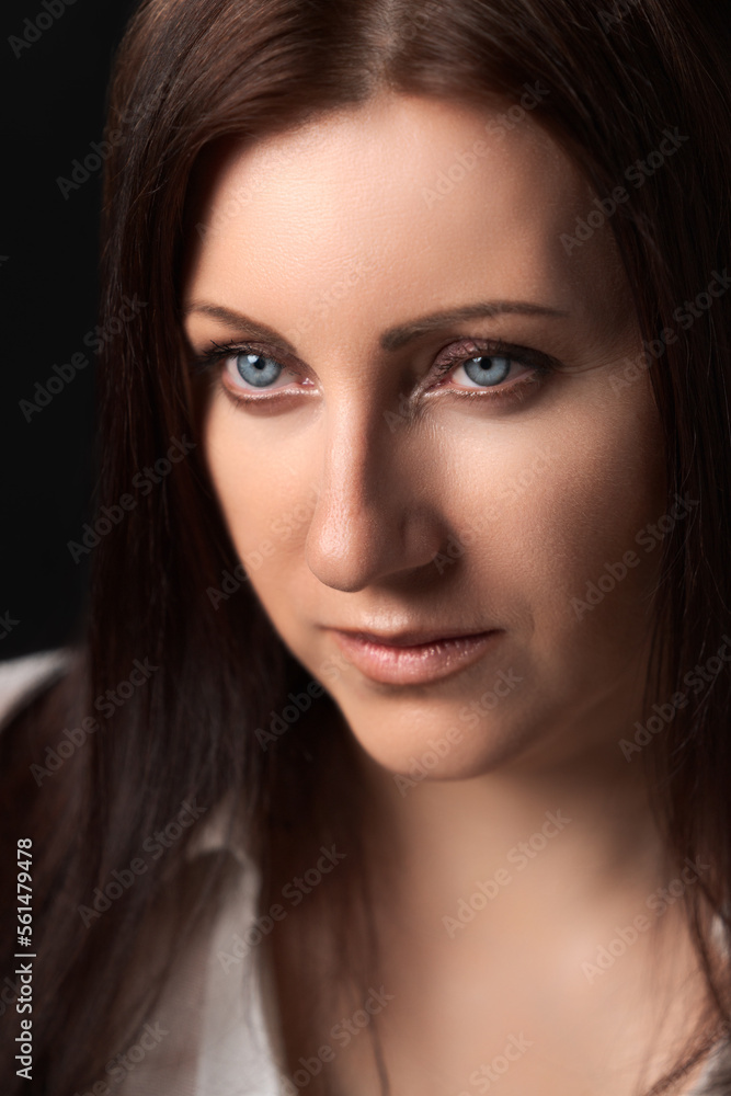 Portrait of Caucasian ethnicity adult woman forty years old. Beautiful female human face of brunette with gray eyes. Soft selective focus, deep-of-field of eyes. Portrait of Caucasian ethnicity adult woman forty years old. Beautiful female human face of brunette with gray eyes. Soft selective focus, deep-of-field of eyes.