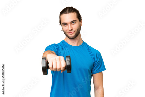 Young handsome man isolated on green chroma background making weightlifting