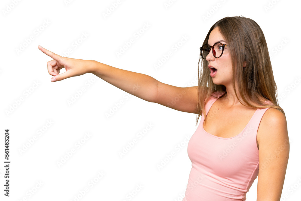 Young pretty woman over isolated background pointing away Young pretty woman over isolated background pointing away