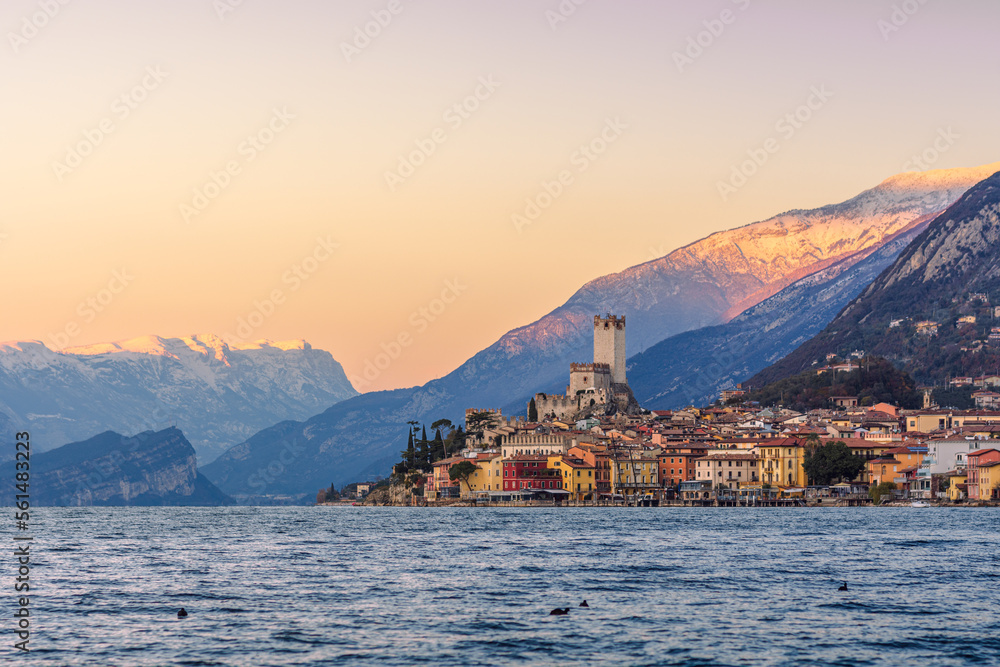 The village and castle of Malcesine sul Garda at sunset