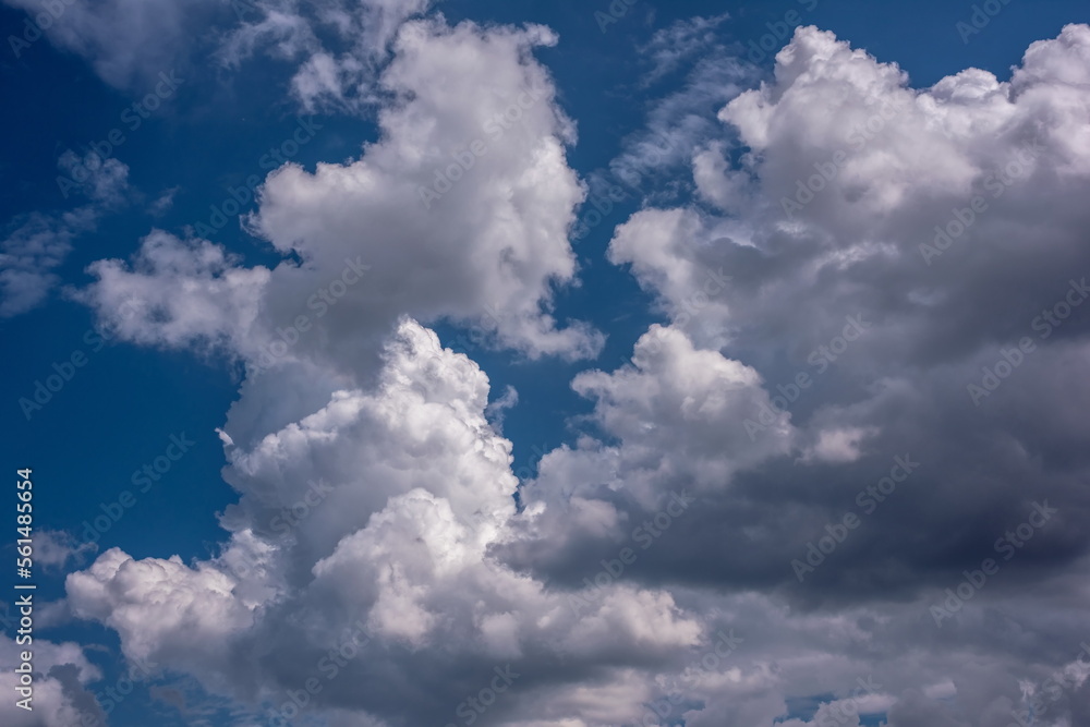 beautiful fluffy white clouds in the blue sky beautiful blue sky with sunlit white clouds as a natural background